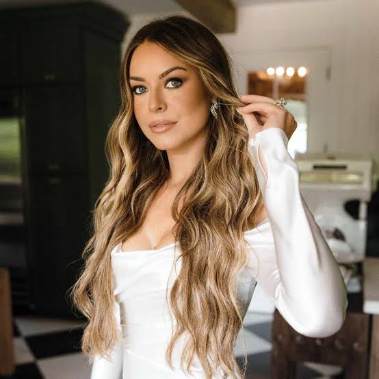 Mid-Back Ash Blonde Waves with Curtain Bangs and Wavy — Classy Extensions Hair