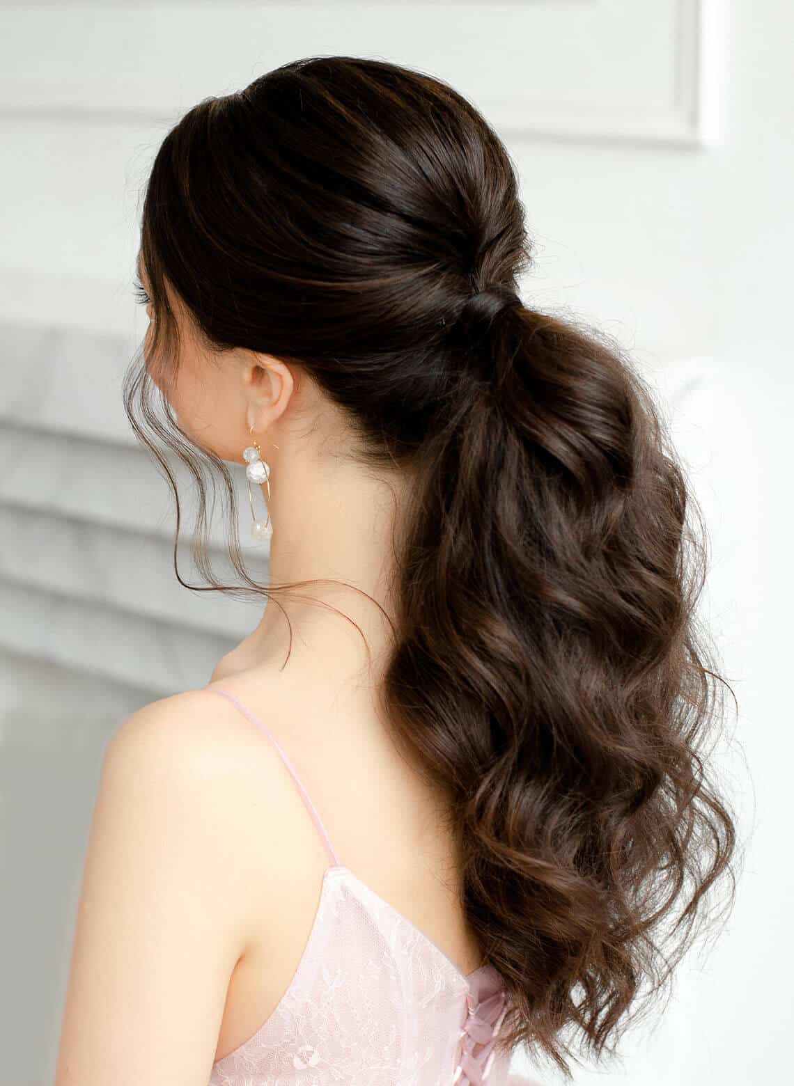 Voluminous Dark Brown Ponytail With Loose Waves — Classy Going Out Hairstyles
