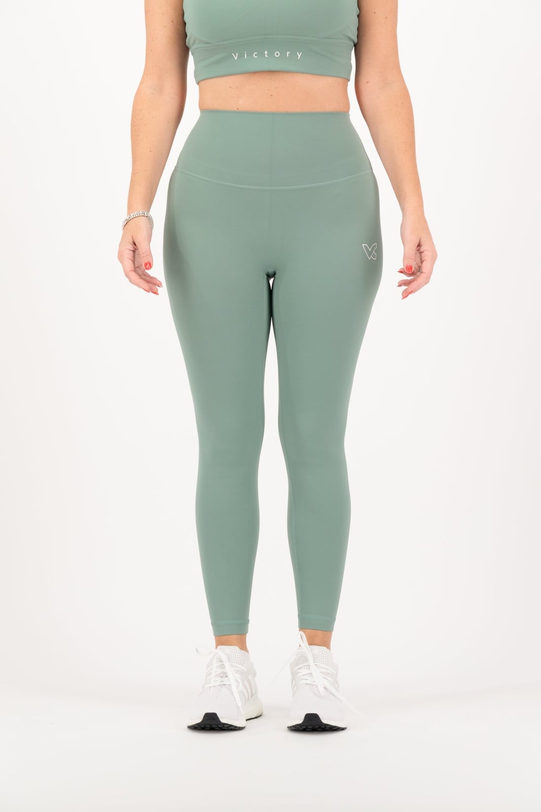 Sage Green Ribbed Leggings with Matching Sports Bra and Sneakers Sage Green Ribbed Leggings with Matching Sports Bra and Sneakers — Classy Green Leggings Outfit