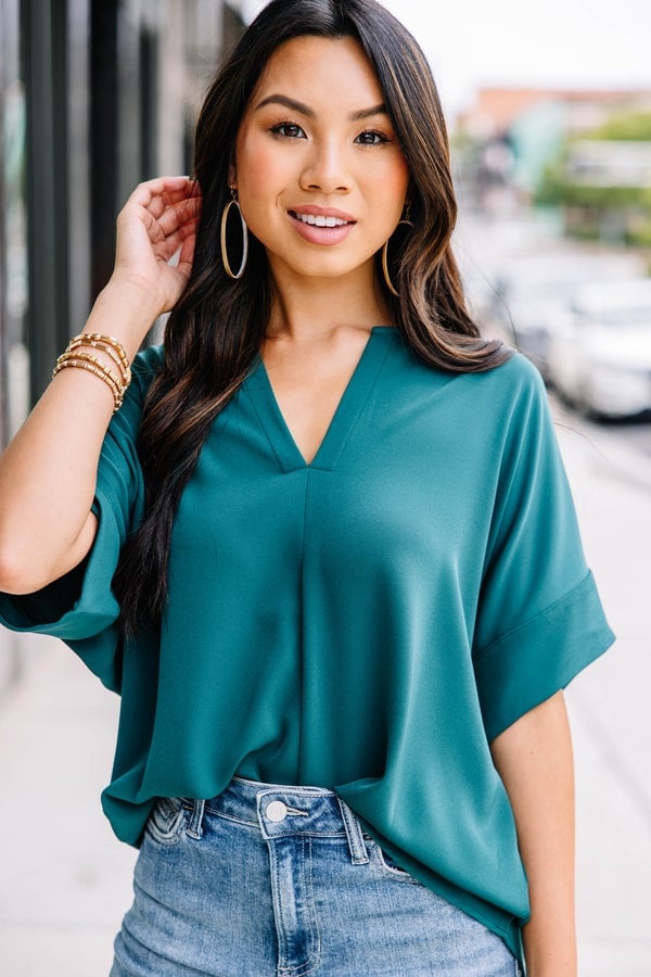 Deep green v-neck crepe top with light wash jeans — Classy Green Top Outfits