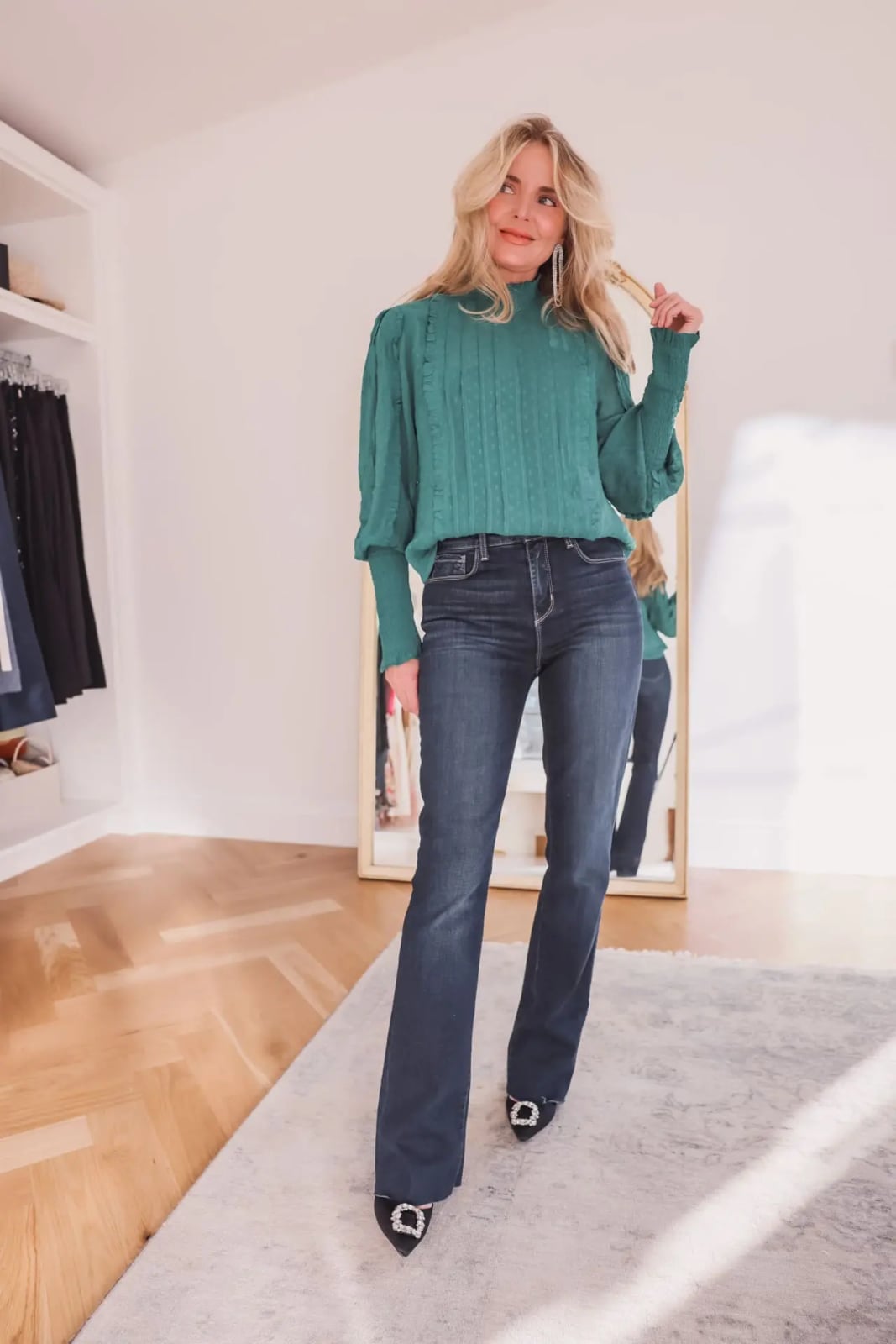 Emerald green textured knit mock neck top with flared jeans — Classy Green Top Outfits