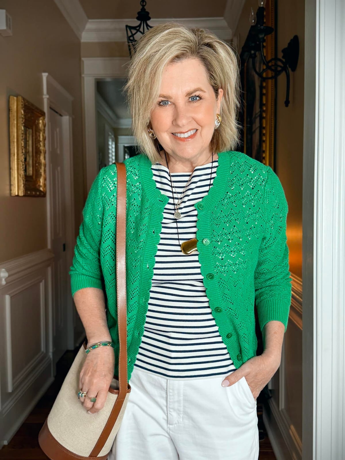 Bright green knit cardigan over striped t-shirt with white pants — Classy Green Top Outfits