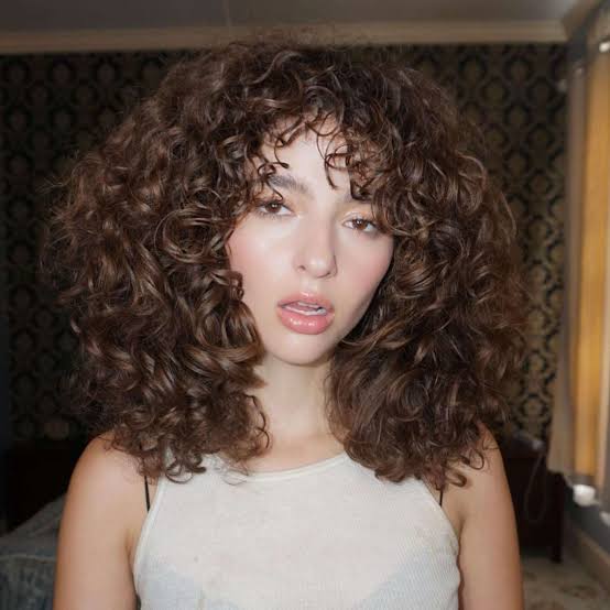 Mid-Length Curly Shag With Full Bangs Mid-Length Curly Shag With Full Bangs — Classy Hairstyles for Thick Hair