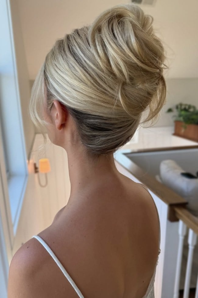 Textured Blonde High Updo With Dark Roots — Classy High Bun Hairstyles