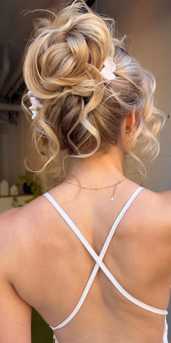 Blonde Textured Bun With Floral Accents — Classy High Bun Hairstyles