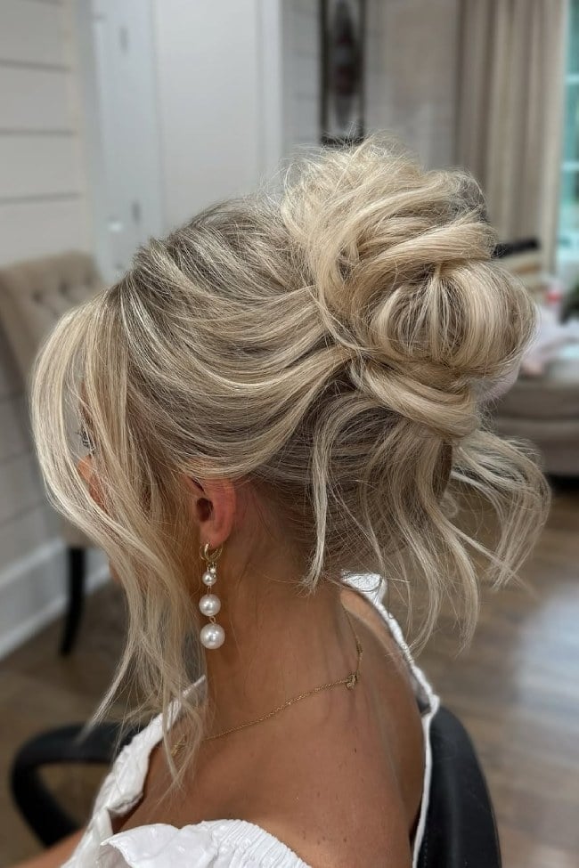 Ash Blonde Messy Updo With Tendrils — Classy High Bun Hairstyles