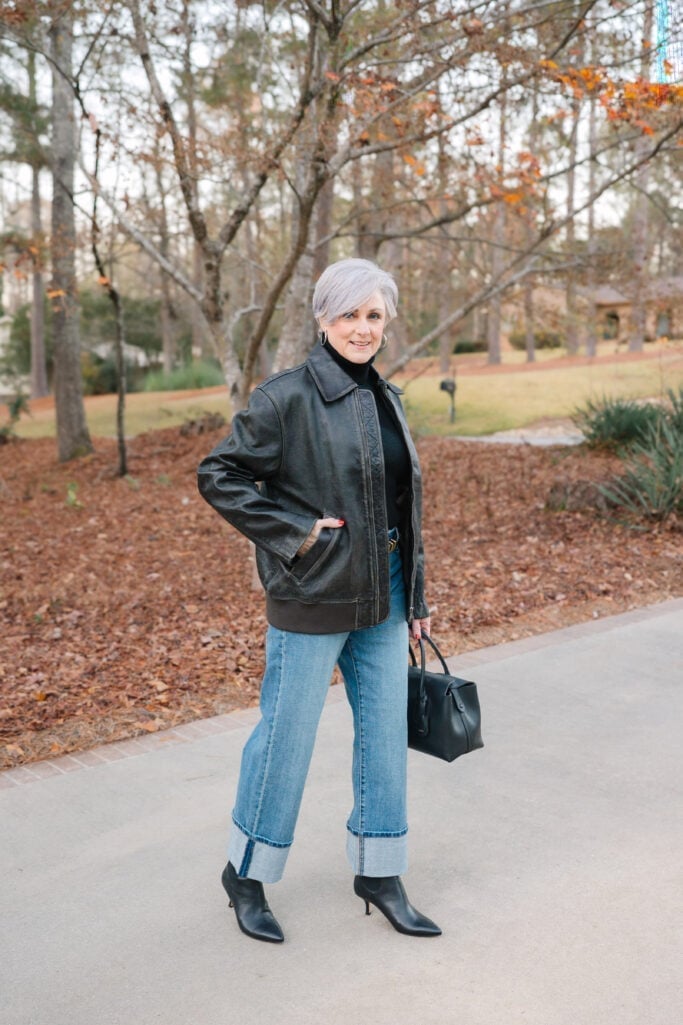 Black leather bomber jacket with light blue jeans — Classy Jacket Outfits