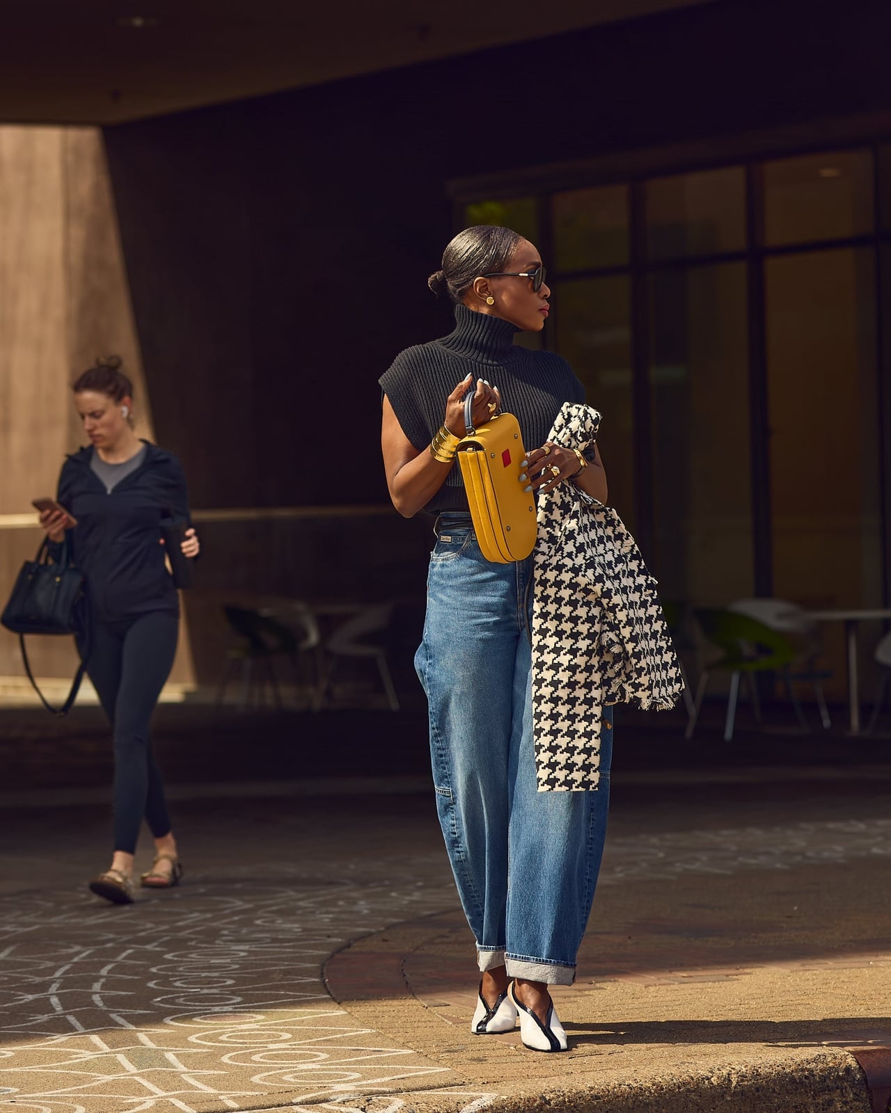 Houndstooth jacket with wide-leg jeans and yellow handbag — Classy Jacket Outfits