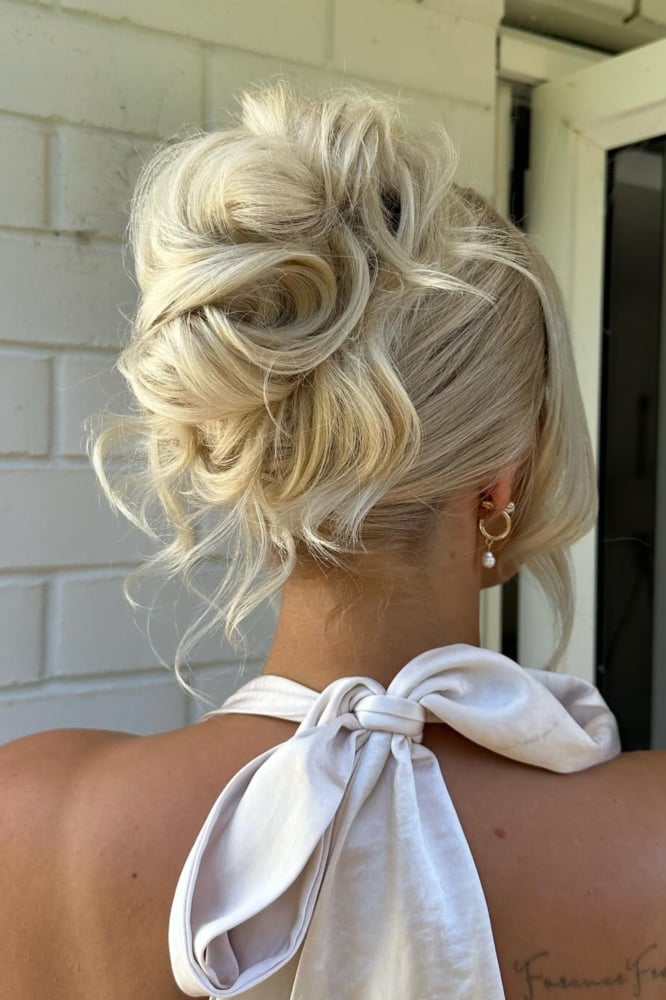 High Messy Bun with Platinum Blonde Highlights and Face-Framing Pieces — Classy Messy Bun Updo