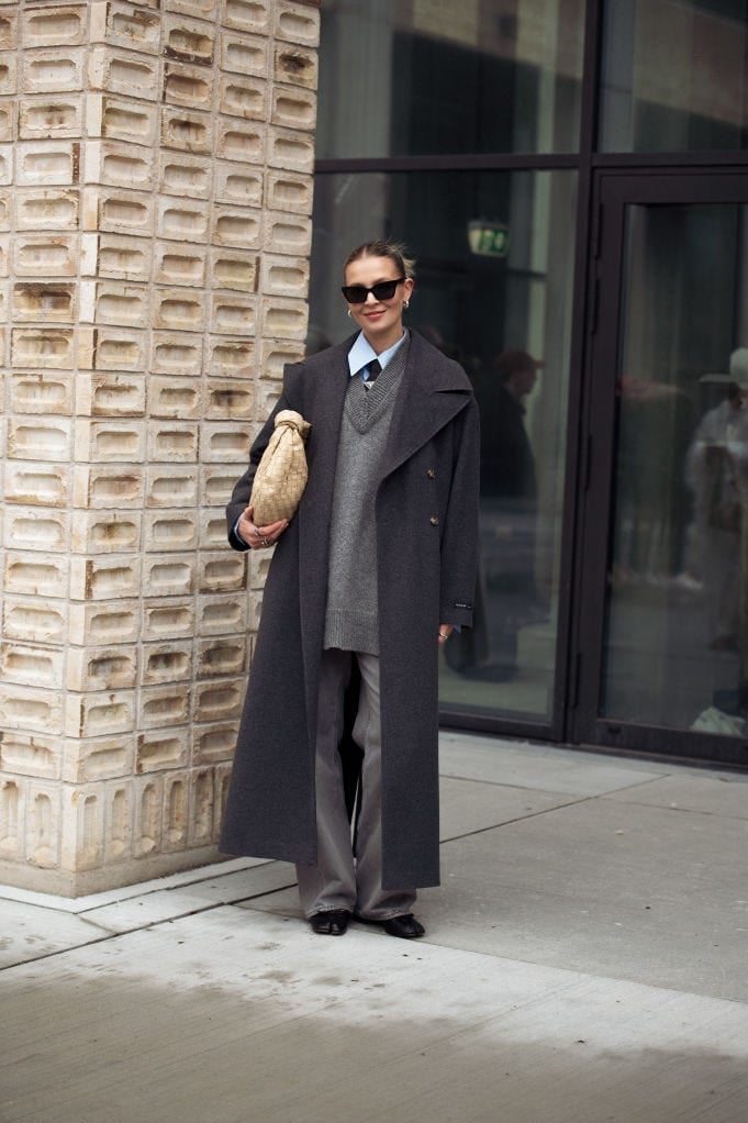 Gray sweater vest over blue shirt with wide-leg trousers and coat — Classy Office Siren Outfits