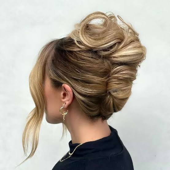 Voluminous Updo With Loose Curtain Bangs — Classy Party Hair