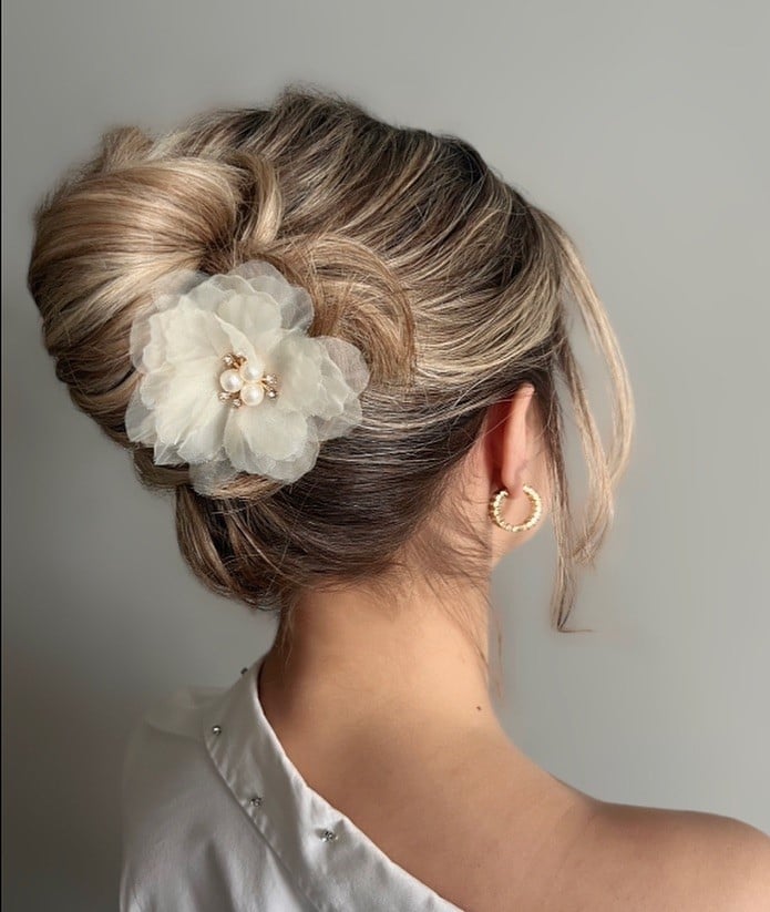 Blonde and Brown Chignon With Floral Accessory — Classy Party Hair