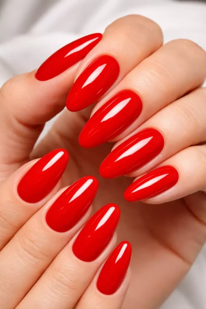 Vibrant Glossy Red Medium Almond Nails, Close-Up Take Vibrant Glossy Red Medium Almond Nails, Close-Up Take — Classy Red Almond Nails