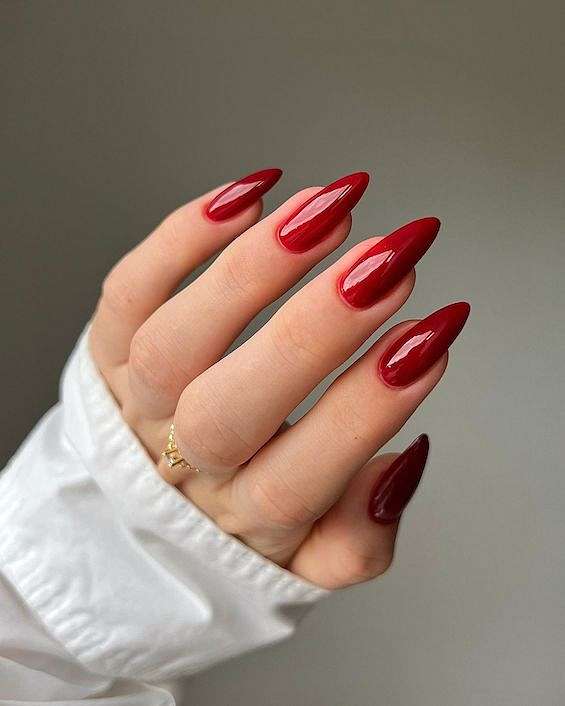 Deep Glossy Red Medium Long Almond, Emphasizing, Close-Up Take Deep Glossy Red Medium Long Almond, Emphasizing, Close-Up Take — Classy Red Almond Nails