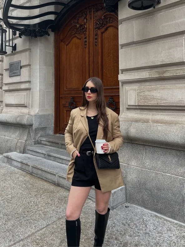 Oversized beige blazer with black shorts and knee-high boots — Classy Streetwear Outfits