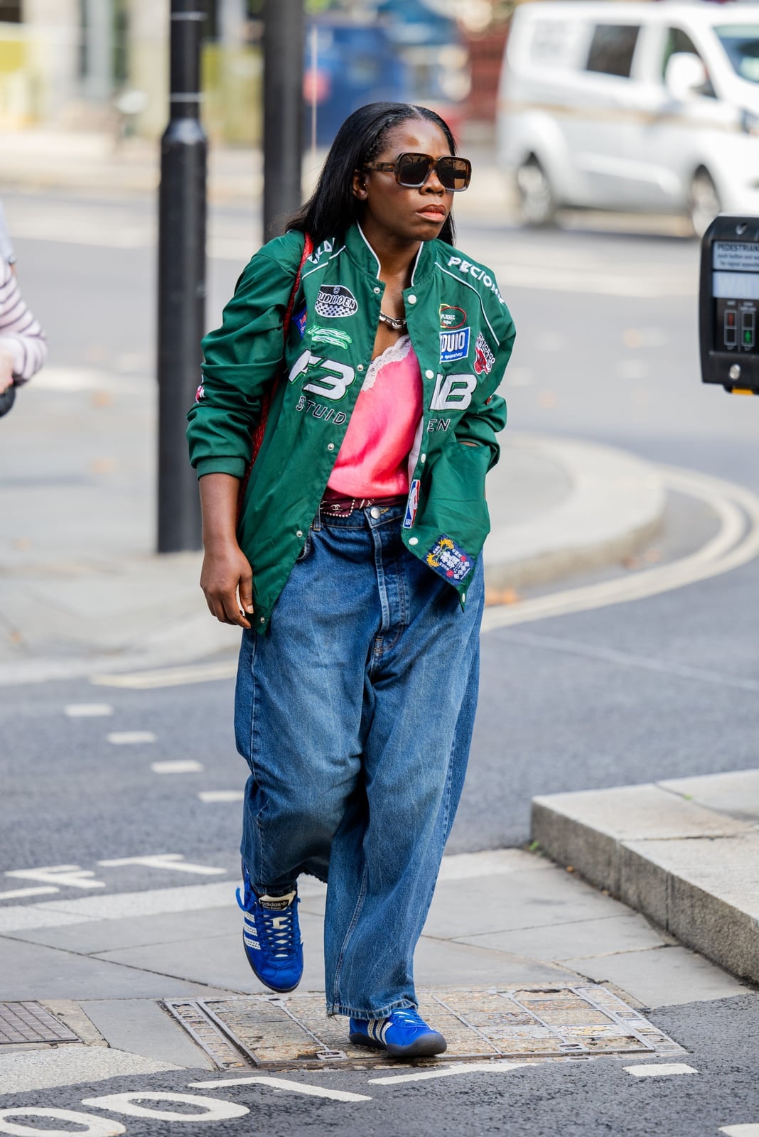 Green bomber jacket with baggy jeans for a bold statement — Classy Streetwear Outfits
