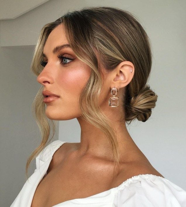 Blonde Low Bun With Loose Waves — Classy Wedding Guest Updos