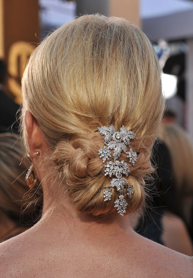 Braided Updo With Floral Accessory — Classy Wedding Guest Updos