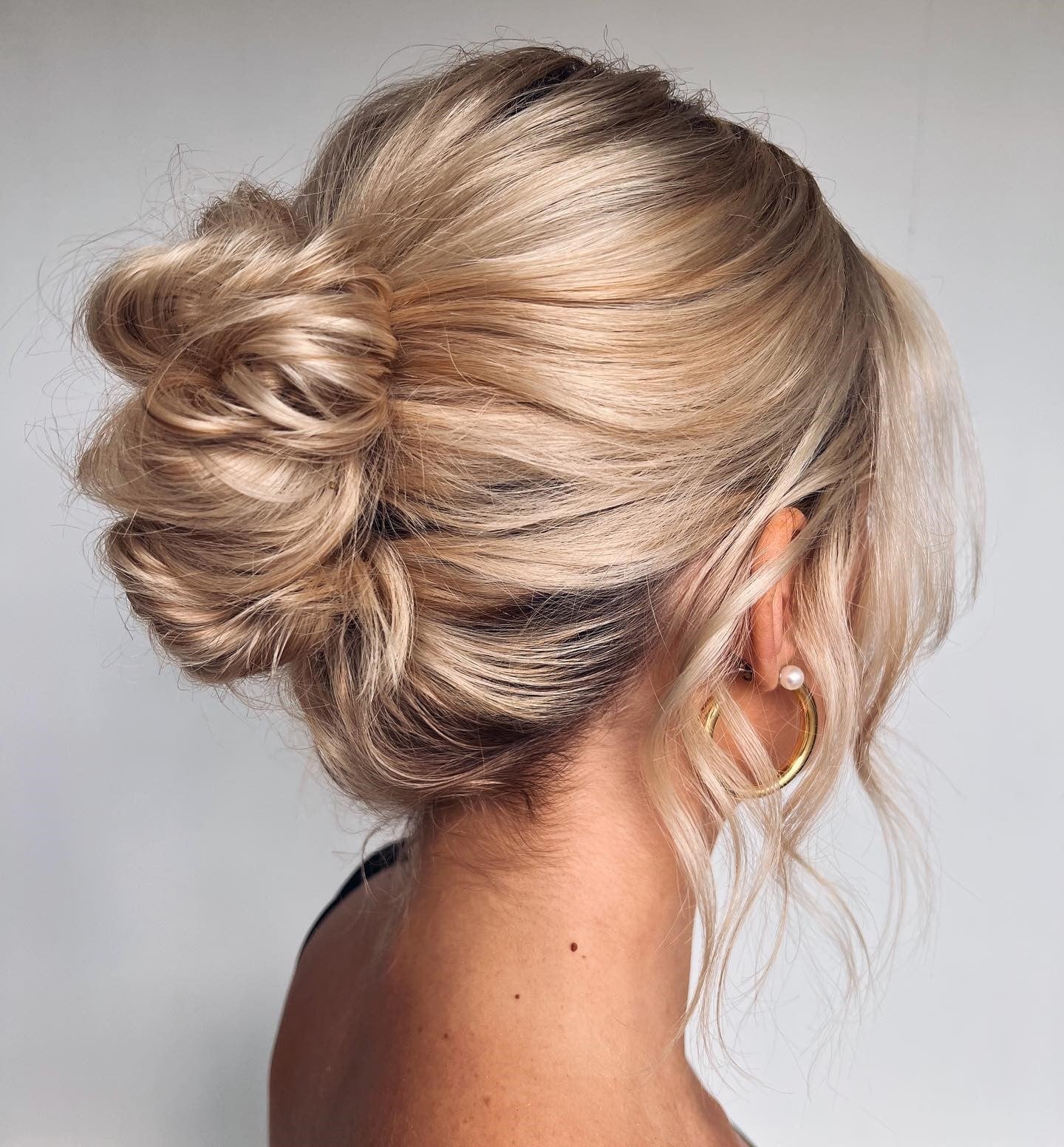 Platinum Blonde Messy Low Bun — Classy Wedding Guest Updos