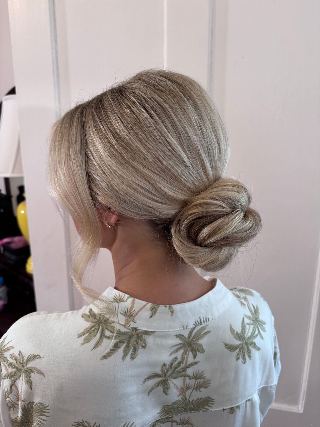Ash Blonde Low Bun With Side Bangs — Classy Wedding Guest Updos