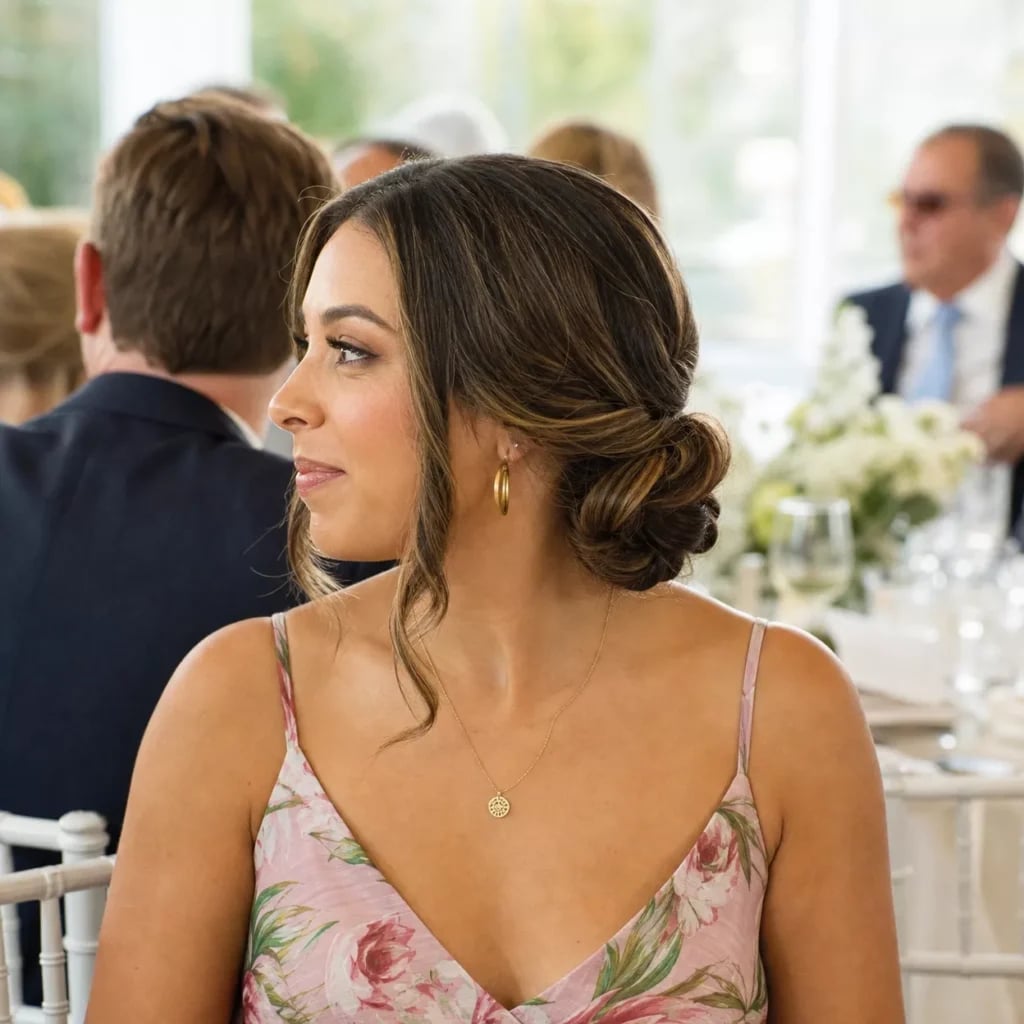 Dark Brown Low Bun With Loose Tendrils — Classy Wedding Guest Updos