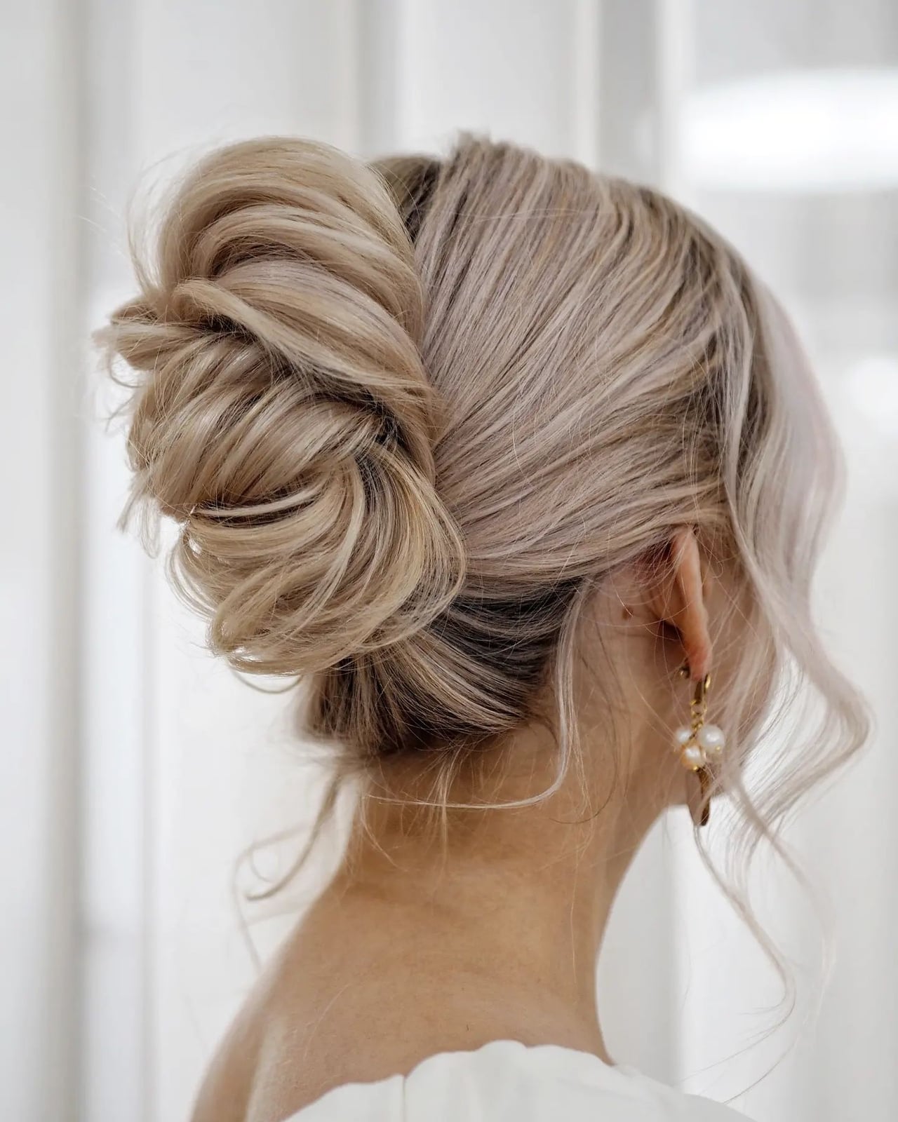 Intricate Twisted Low Bun With Loose Tendrils — Classy Wedding Hair