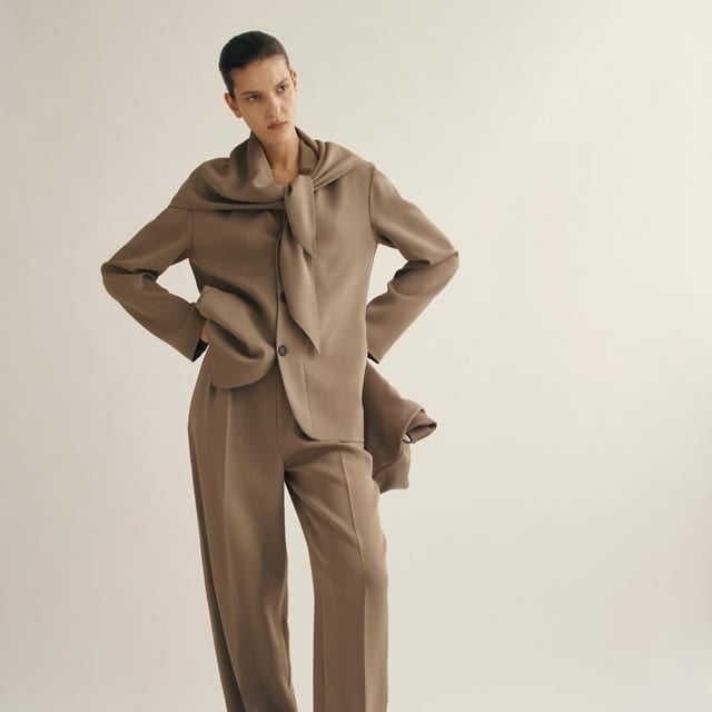 Relaxed taupe suit with draped scarf detail — Classy Work Outfits