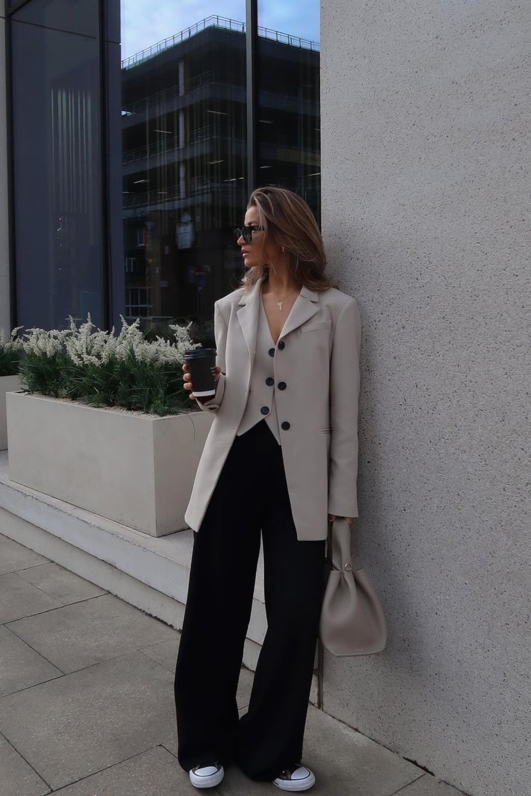 Oversized beige blazer over gray vest and black trousers — Classy Work Outfits