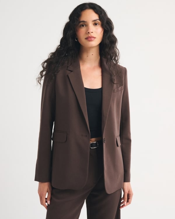 Fitted brown blazer with black tank top and belt — Classy Work Outfits
