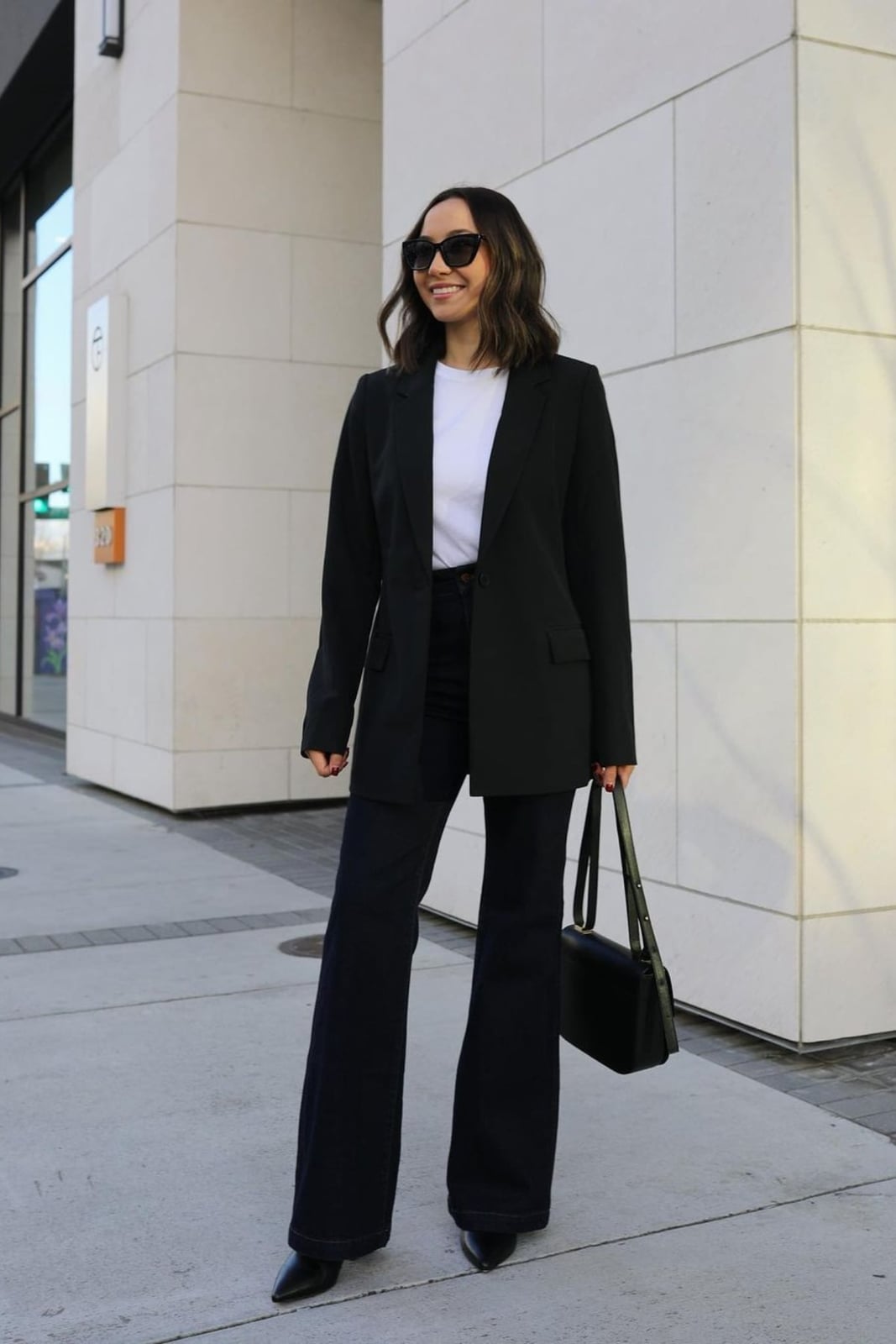 Black blazer, white t-shirt, and flared jeans — Classy Work Outfits