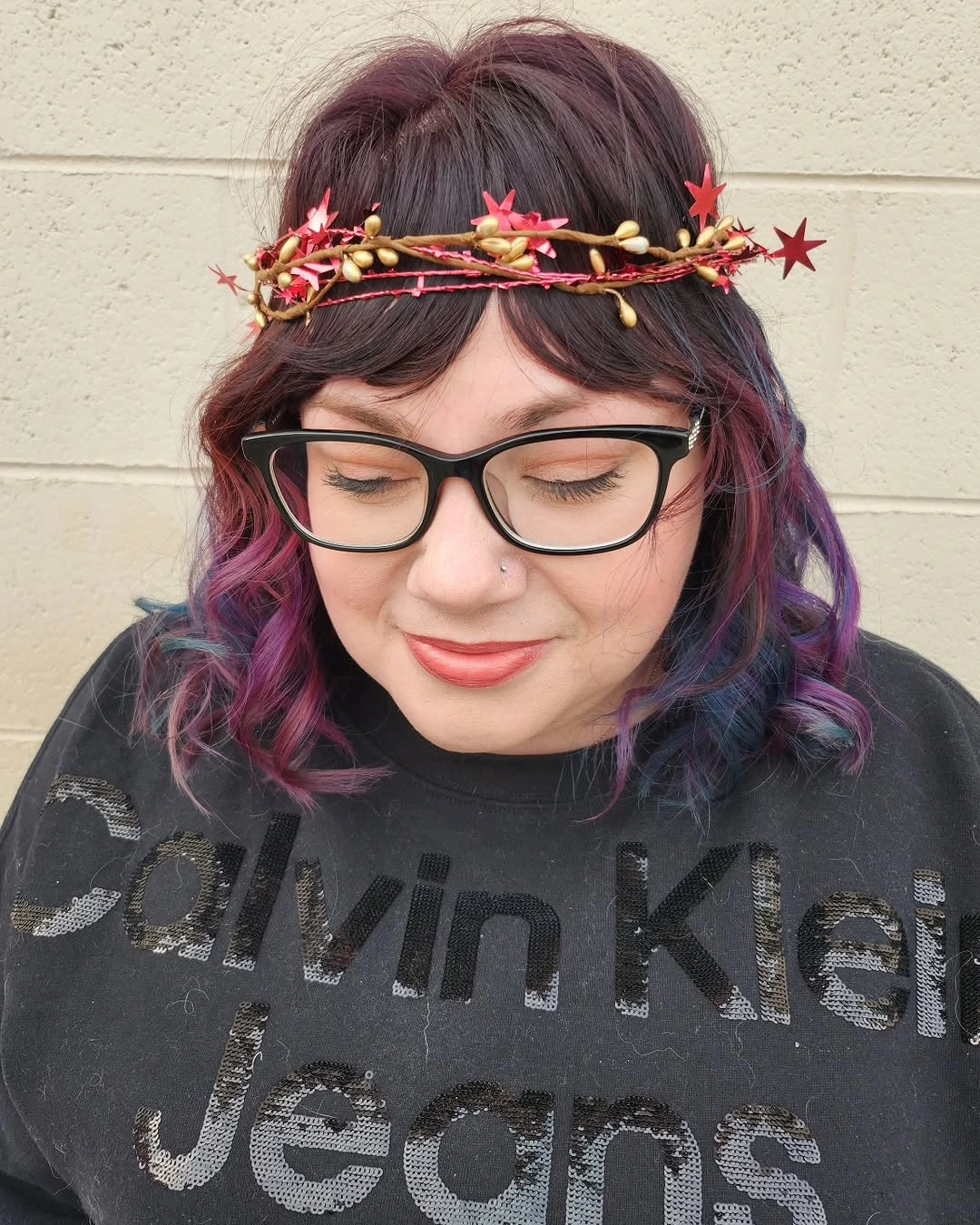 Short plum purple curled hair with pink blue violet ends and decorative headpiece