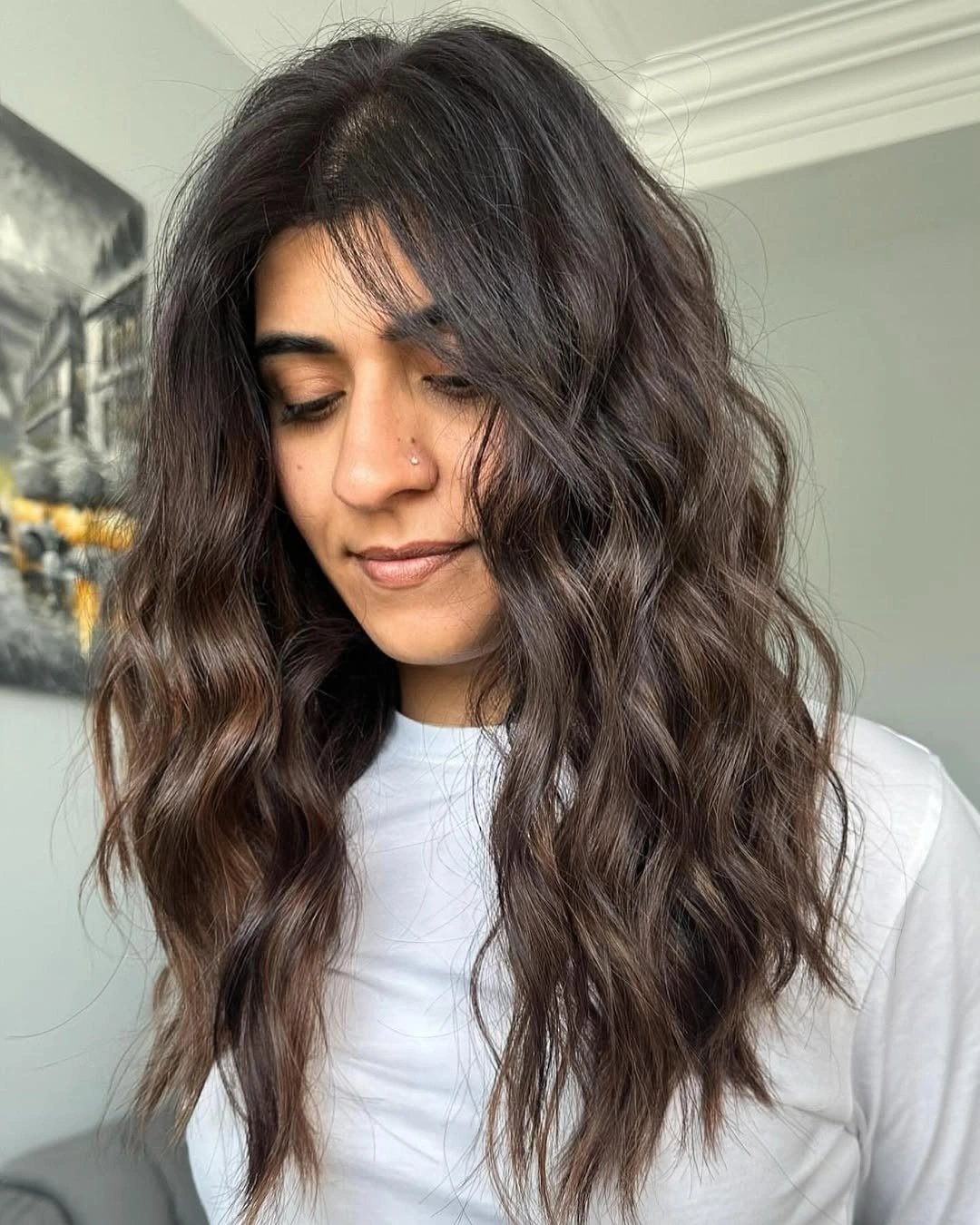 Long dark espresso brown hair with loose chocolate brown waves and face framing layers