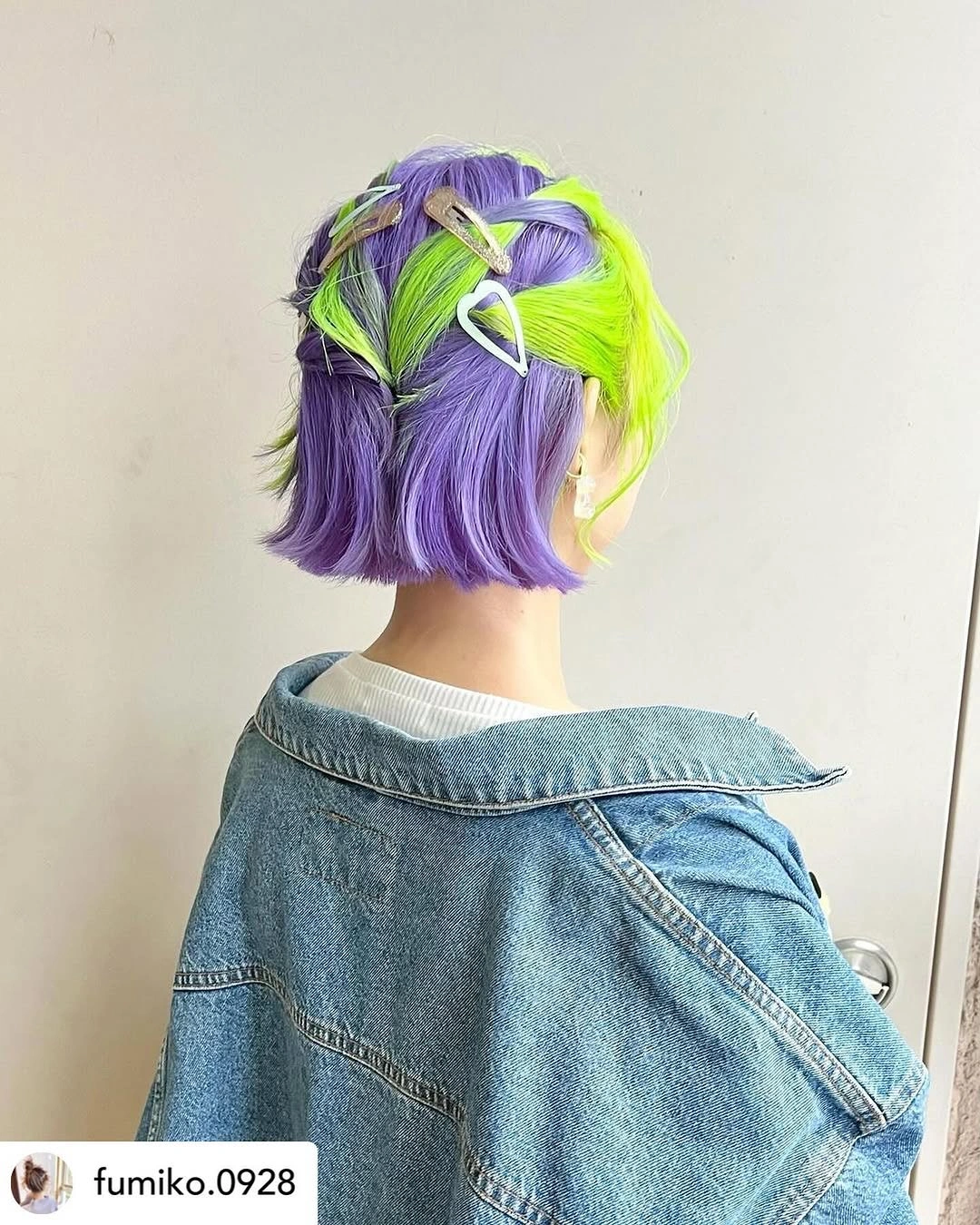 Short purple bob with neon lime green sections and crisscrossed crown strands