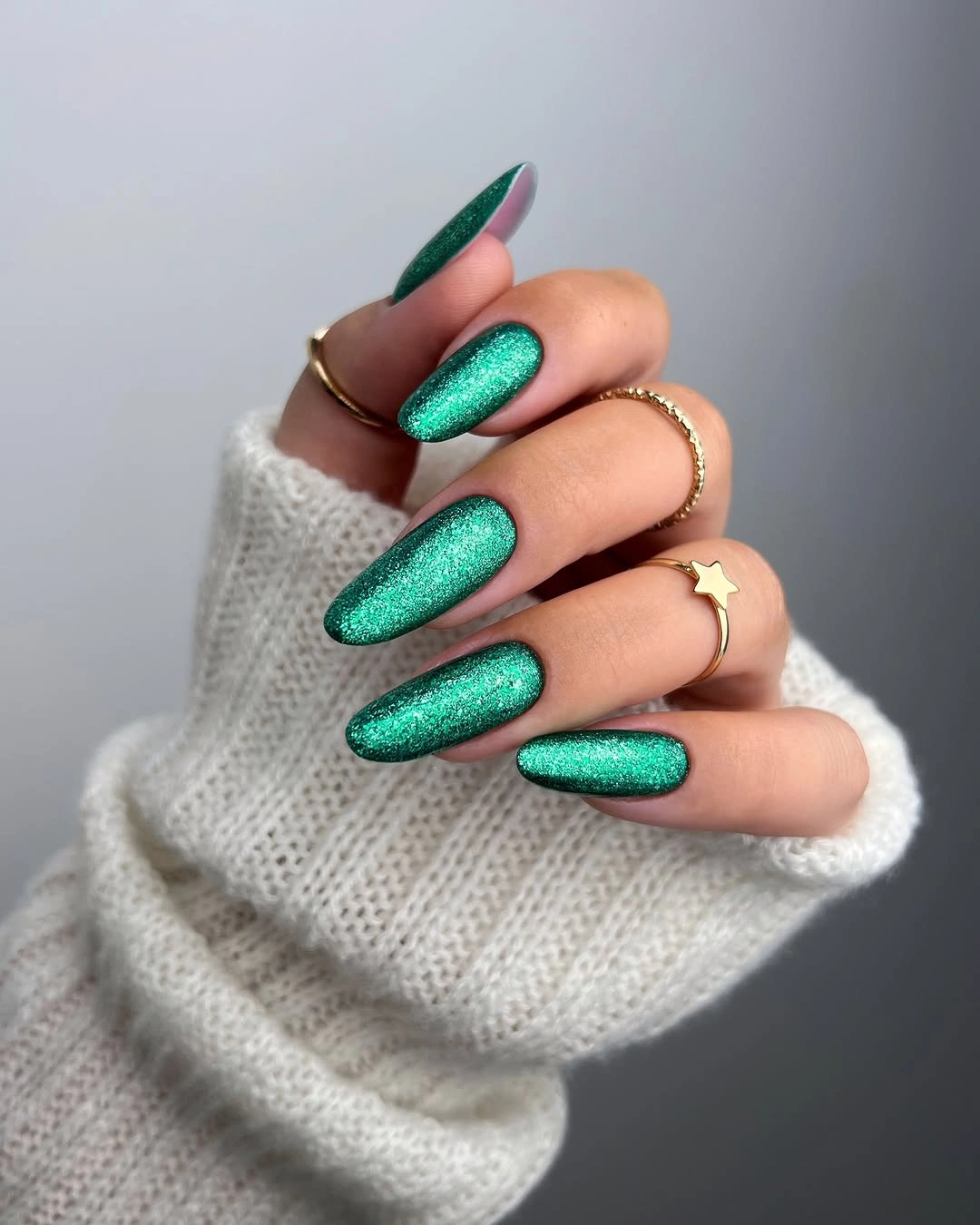 Long pointed almond nails with vivid emerald green shimmer