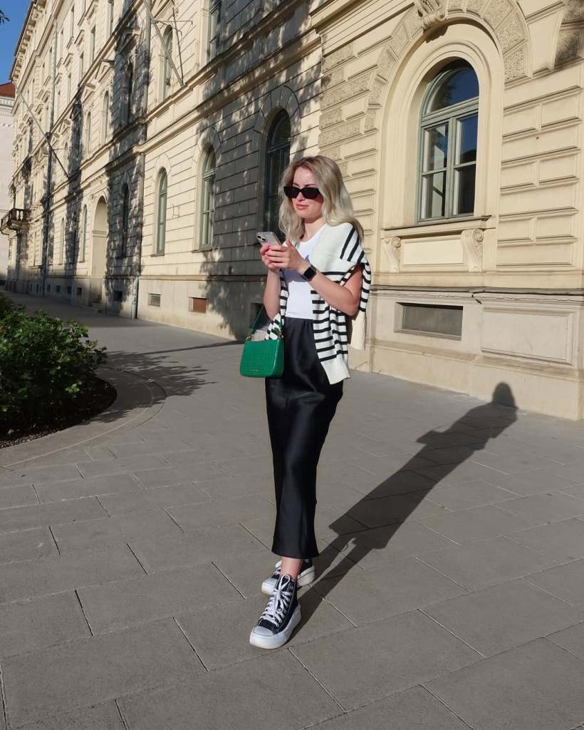 Black satin midi skirt with t-shirt and striped cardigan — Elegant Black Satin Skirt Outfit