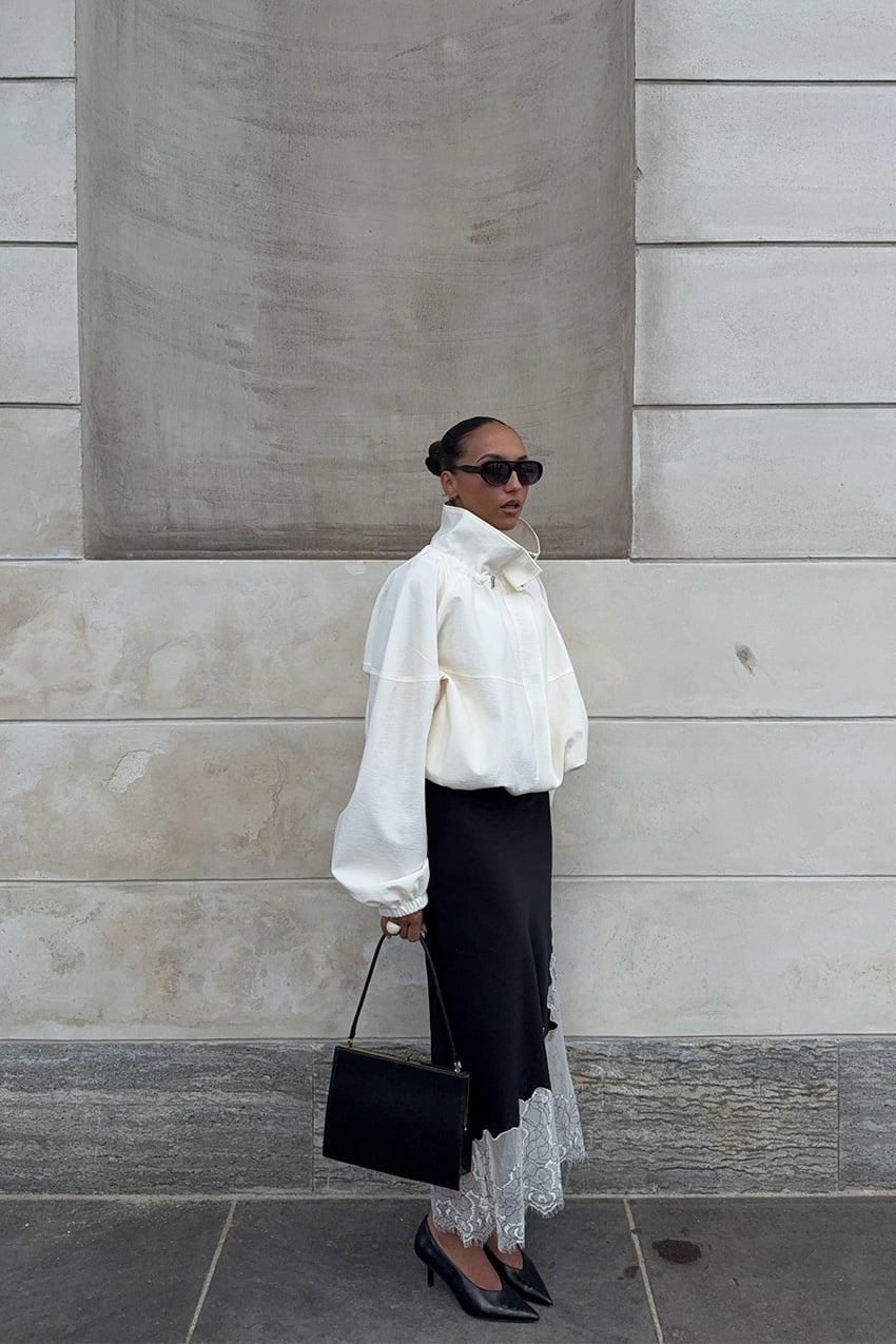 Black satin skirt with lace trim and white jacket — Elegant Black Satin Skirt Outfit