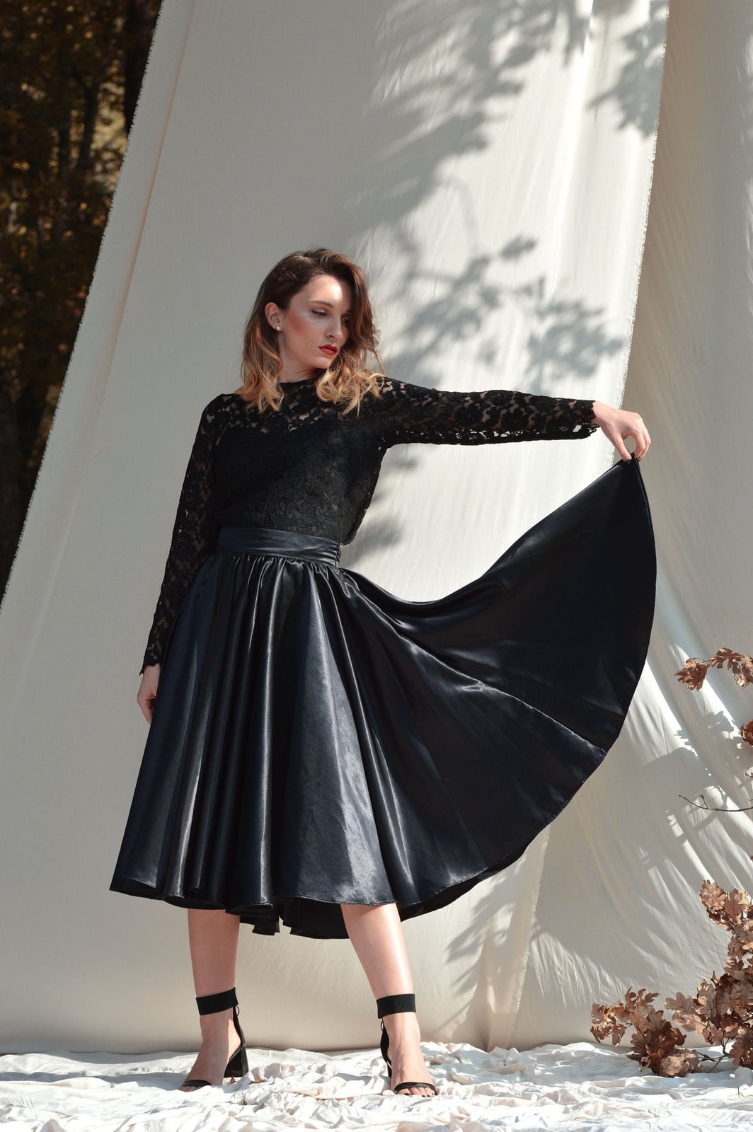 Voluminous black satin midi skirt with lace top — Elegant Black Satin Skirt Outfit
