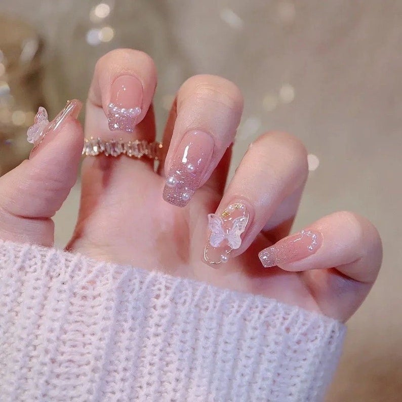 Long Almond Pink Glitter With Pearls And Butterflies Long Almond Pink Glitter With Pearls And Butterflies — Elegant Korean Nail Art