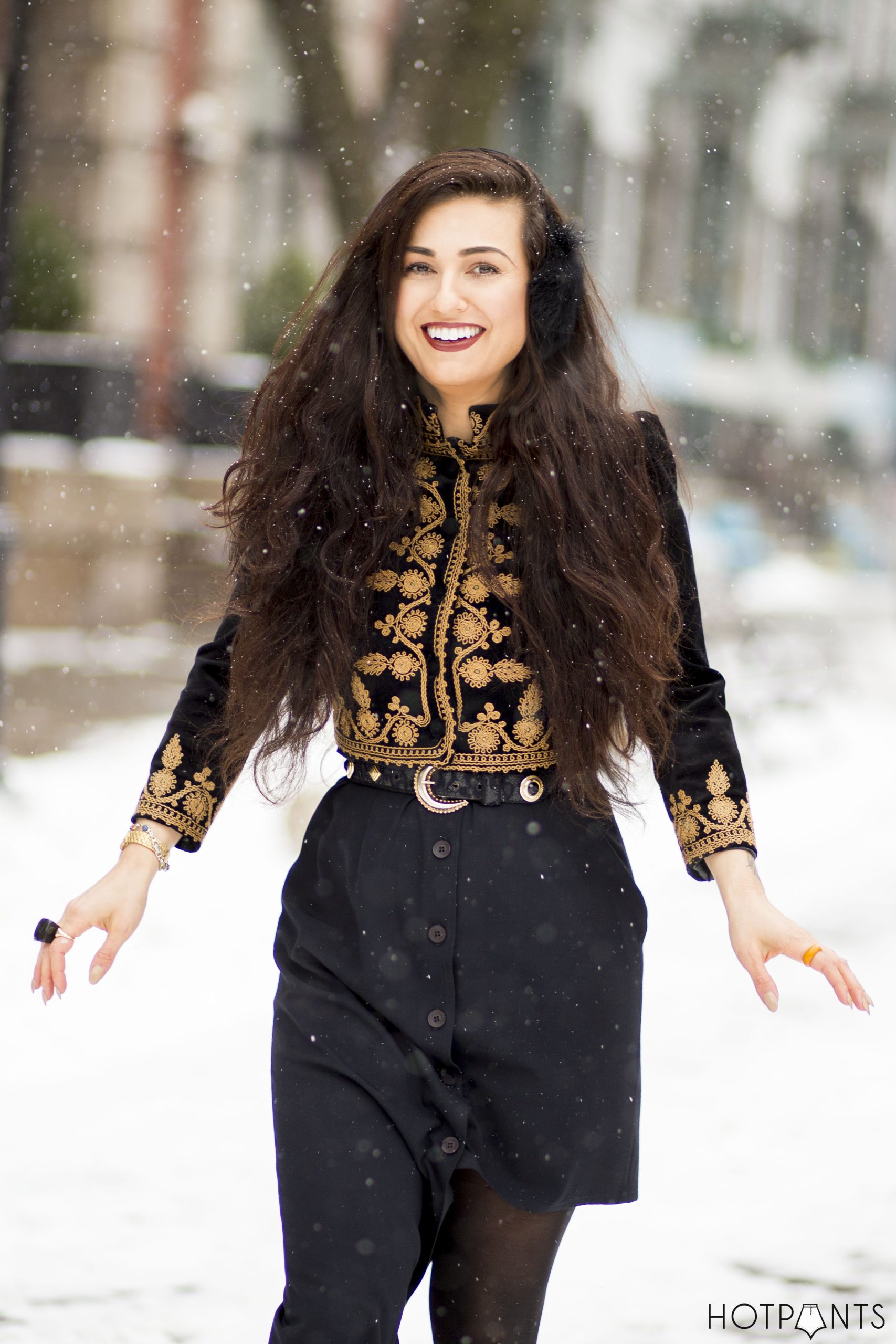 Statement Jacket with Black Earmuffs in Snowy Setting — Earmuffs Outfits