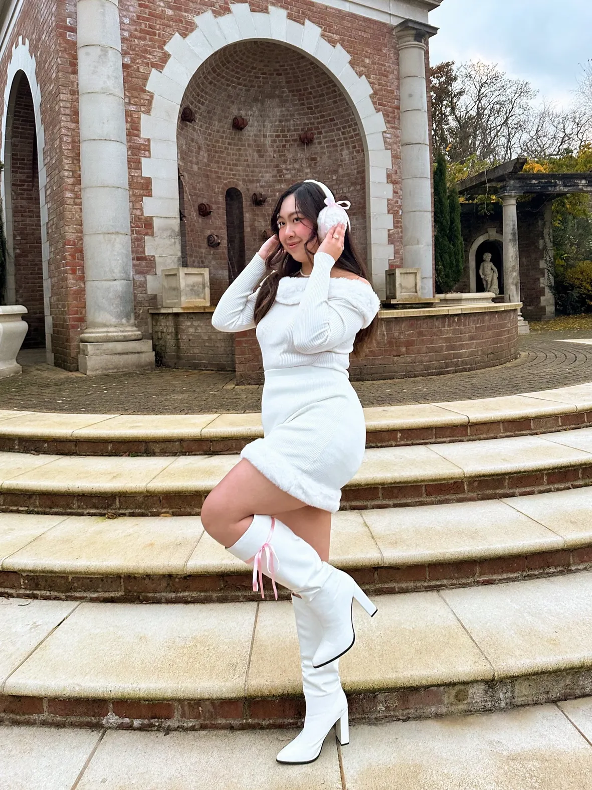 All-White Ensemble: Sweater Dress, Boots, and Fuzzy Earmuffs — Earmuffs Outfits