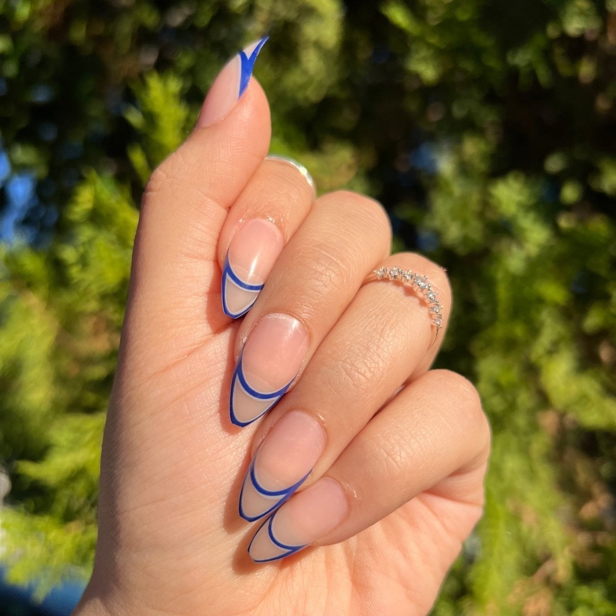 Sheer Nude With Double Blue French Tips — Medium Almond Nails