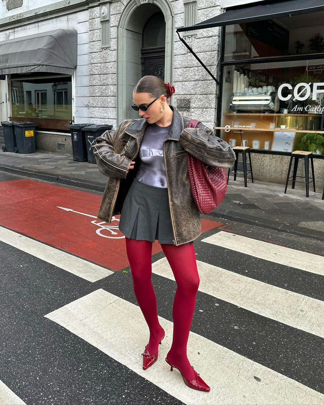 Vibrant red tights with a gray skirt and leather jacket — Outfits with Tights