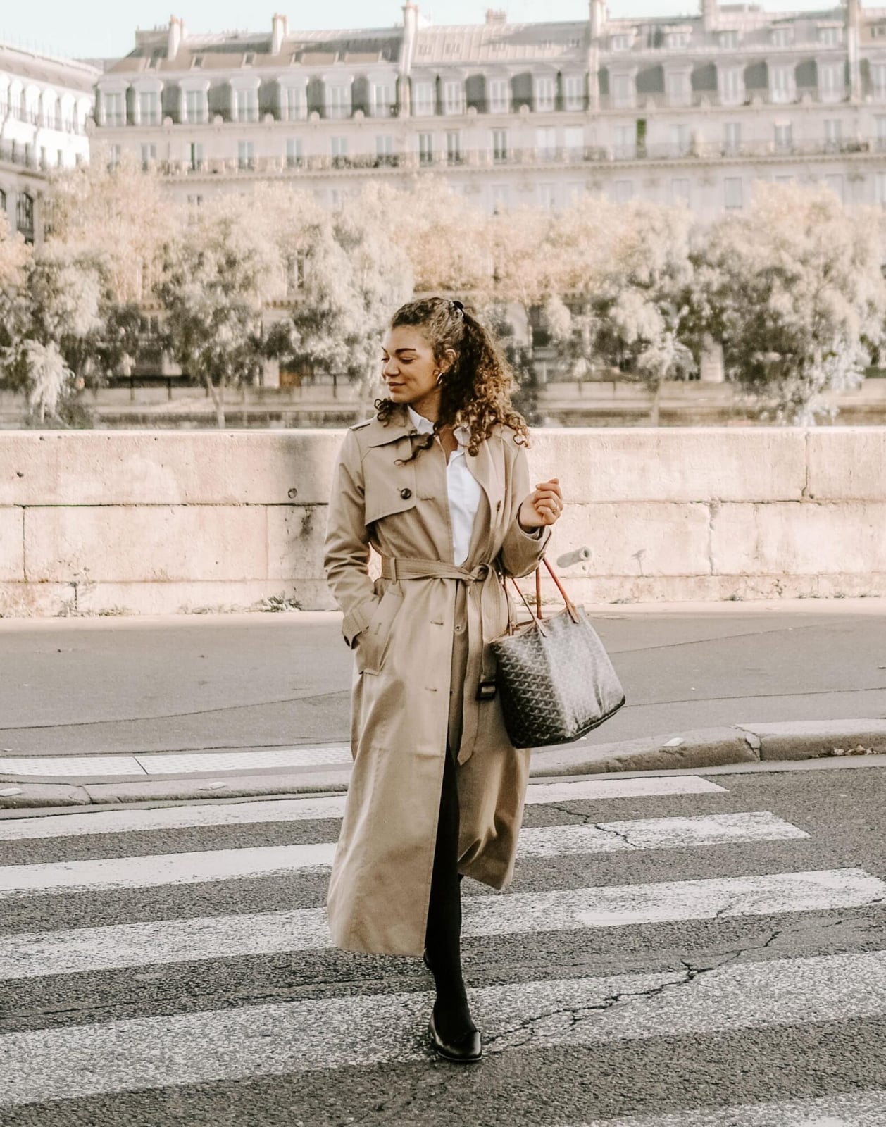 Classic beige trench coat over white shirt and black trousers — Parisian Style