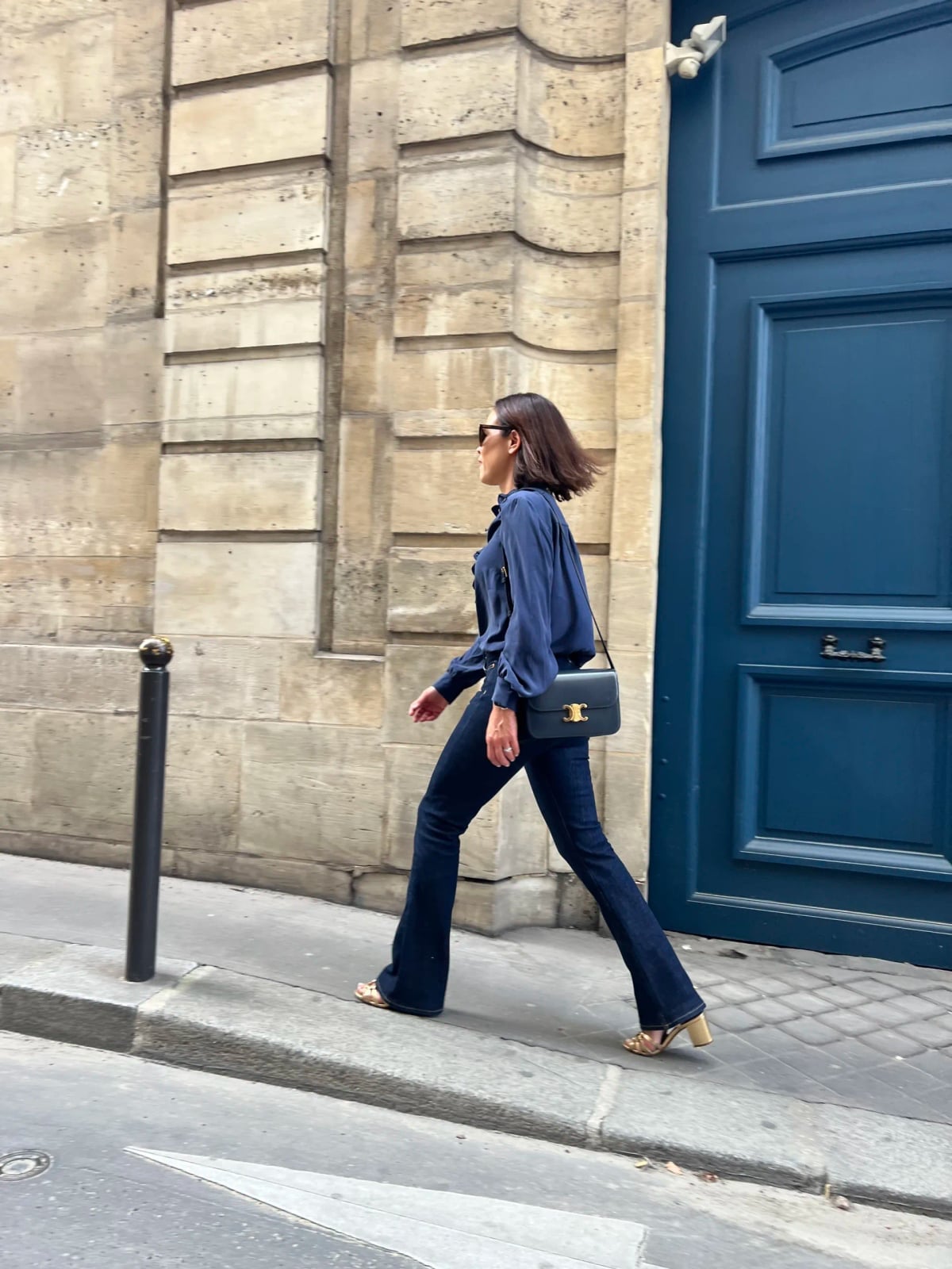 Navy silk blouse with flared jeans — Parisian Style