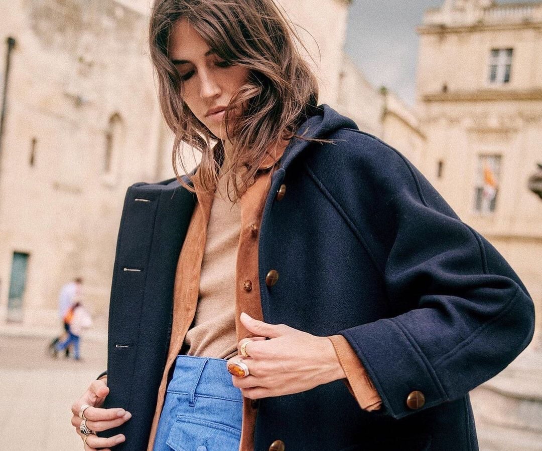 Navy hooded coat over rust sweater and jeans — Parisian Style