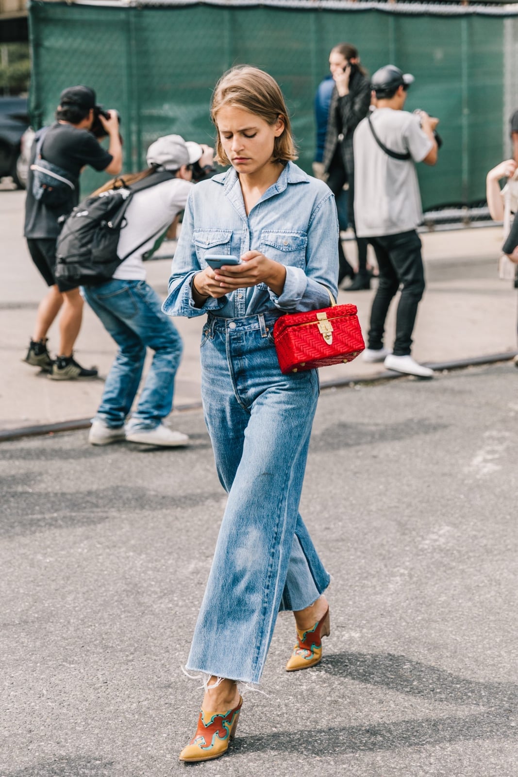 Denim shirt and wide-leg jeans with a red box bag Denim shirt and wide-leg jeans with a red box bag — Restaurant Outfit