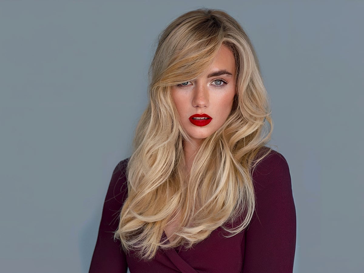 Voluminous Mid-Back Cut With Dramatic Side Swept Bangs