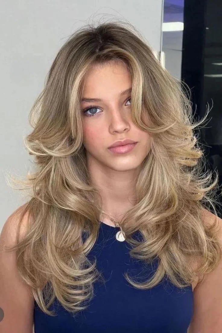 Collarbone Heavy Layers with Curtain Bangs — Simple 90s Blowout Hair