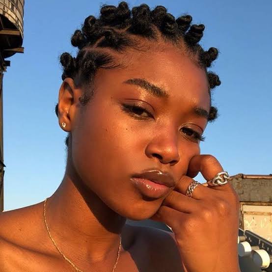 Neat bantu knots with neutral tones and gold jewelry, Close-Up Take — Simple Bantu Knots