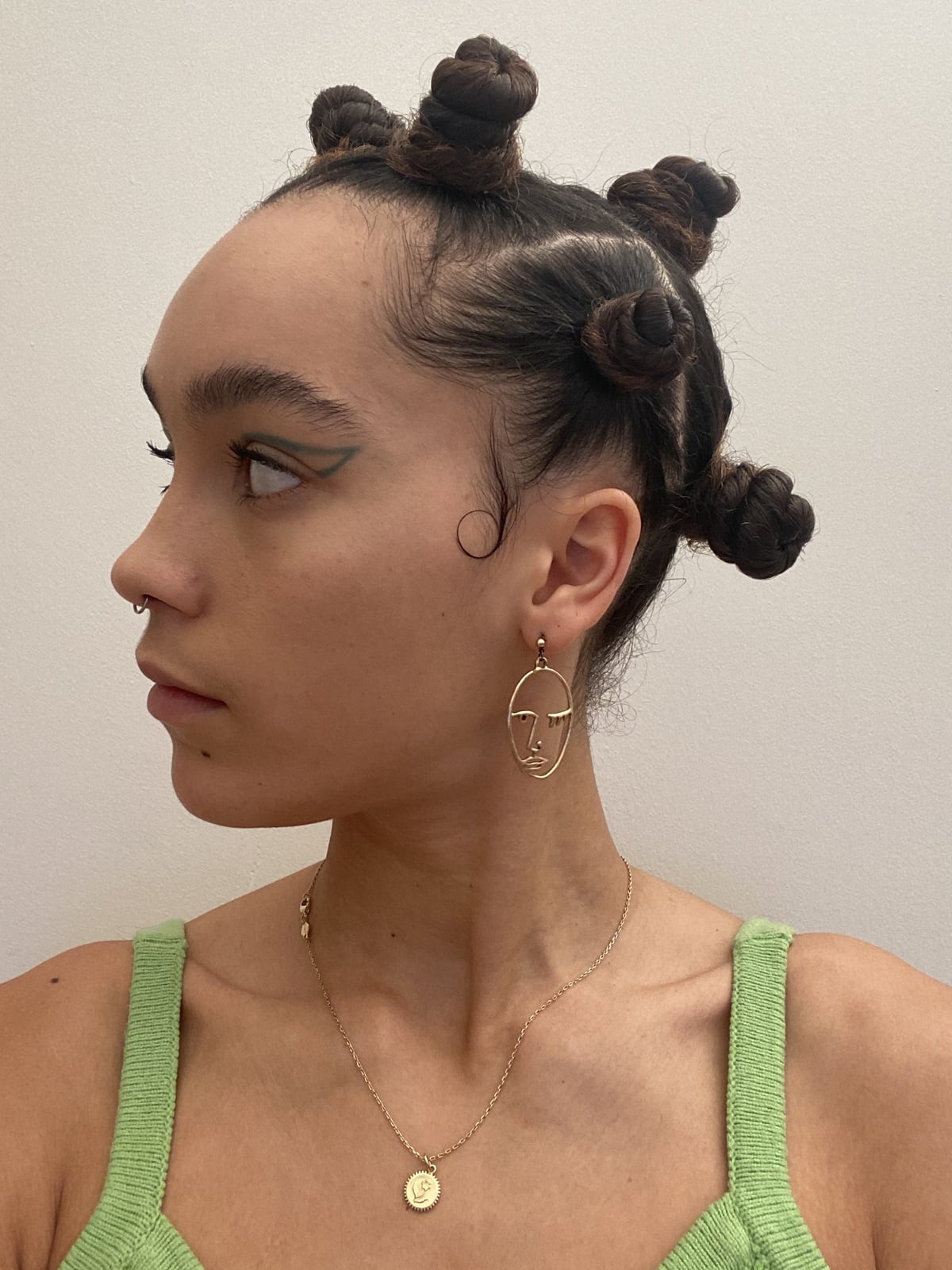 Bantu knots with a green knit tank and statement, Close-Up Take — Simple Bantu Knots